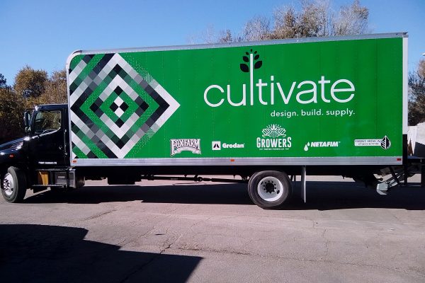 Box truck with custom green wrap